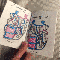 photo of a pair of colored pages of the zine, with a 7 segment display showing the digits 2 and 3